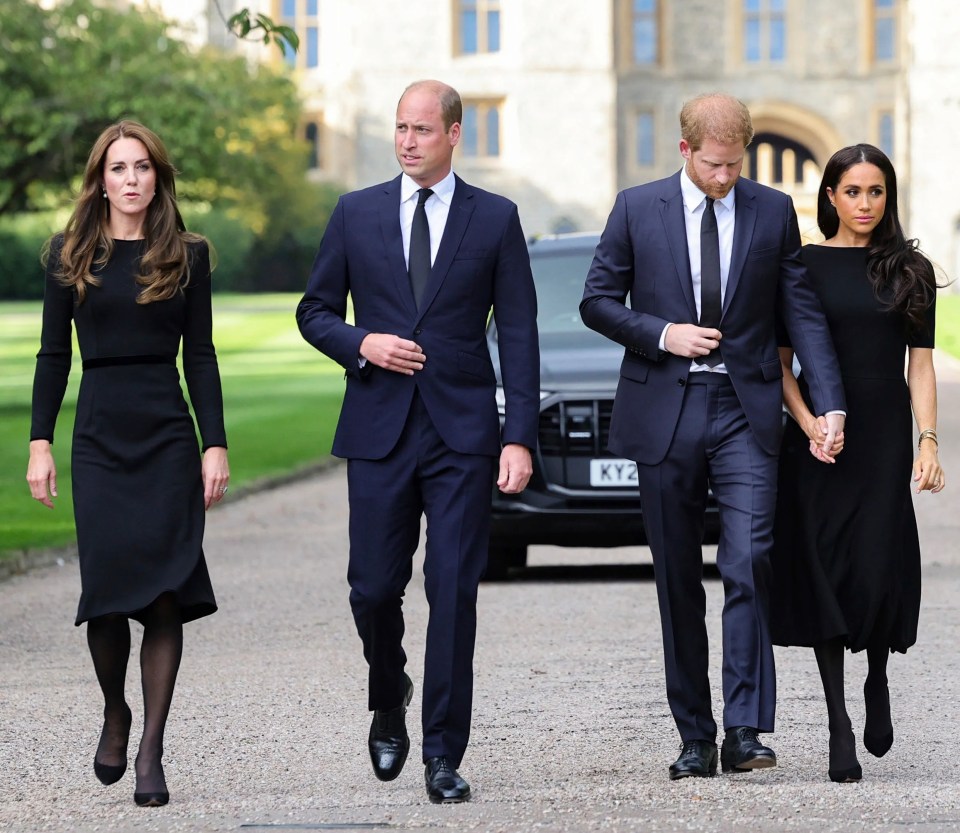 The fab four walk together at Windsor before inspecting tributes left by members of the public following the Queen's death