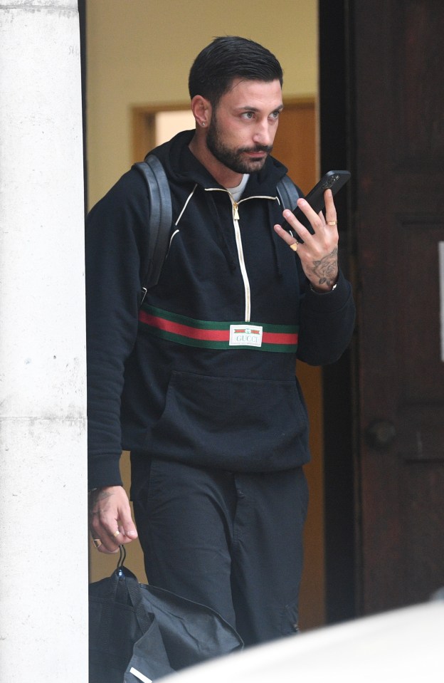 Giovanni could be seen on his phone after practise