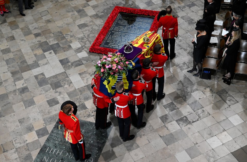 The Queen is carried into Westminster Abbey