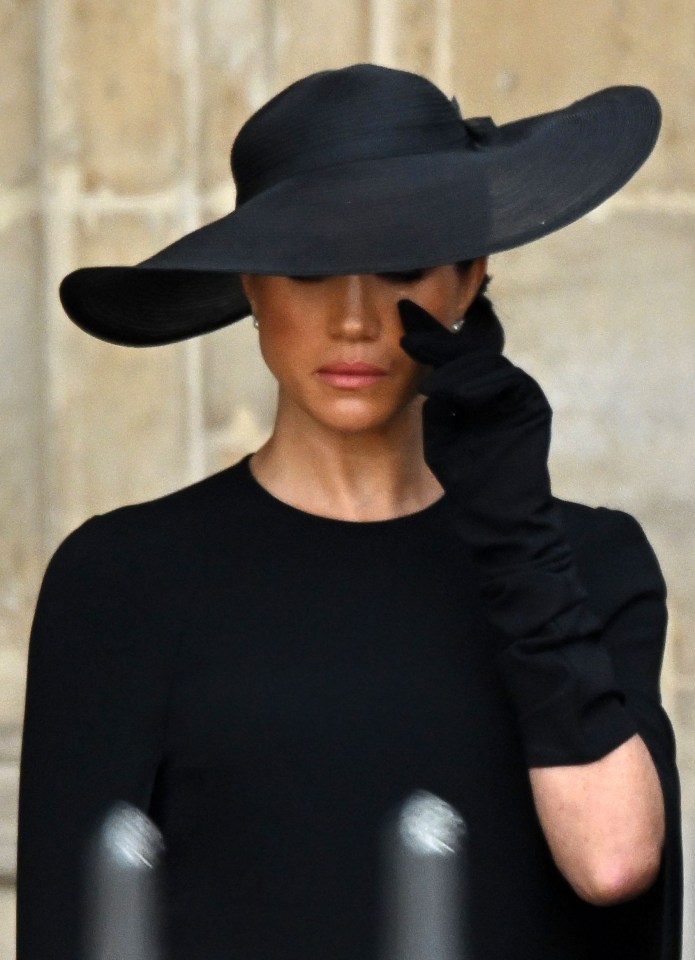 She was seen wiping away tears at Wellington Arch