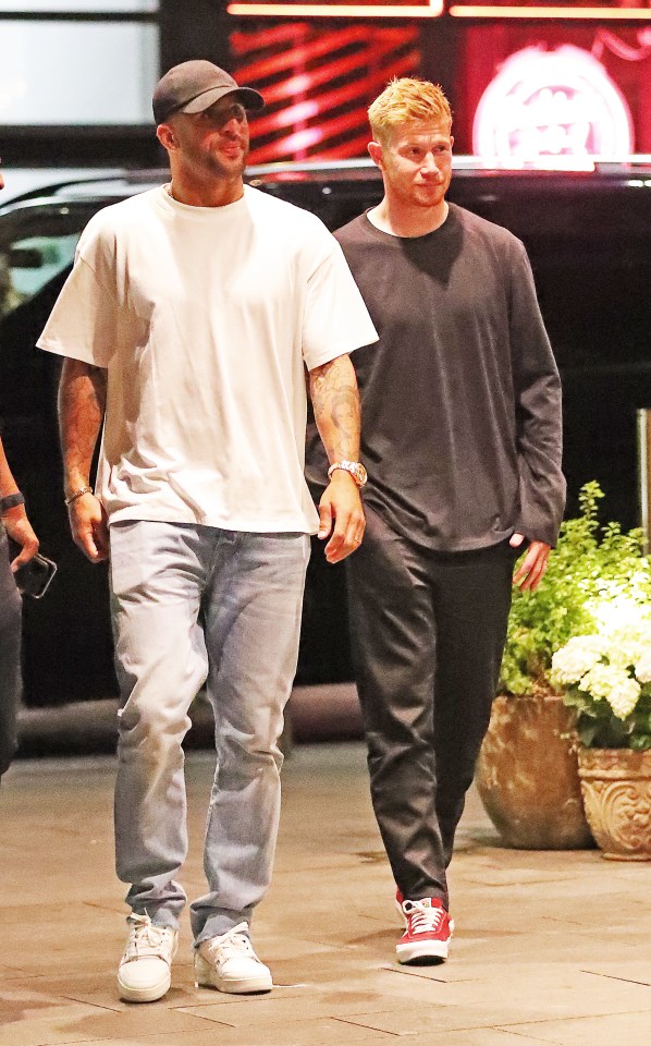 Team-mates Kyle Walker and De Bruyne headed into the restaurant together