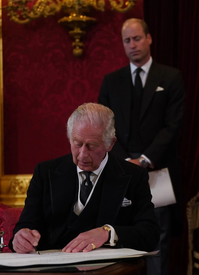 William stood behind Charles as he signed his oath