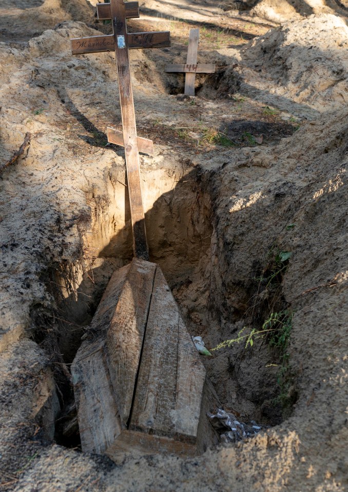 Several other victims found in the sandy soil of the makeshift cemetery on the outskirts of Izyum 'had their genitals amputated', said regional governor Oleh Synyehubov