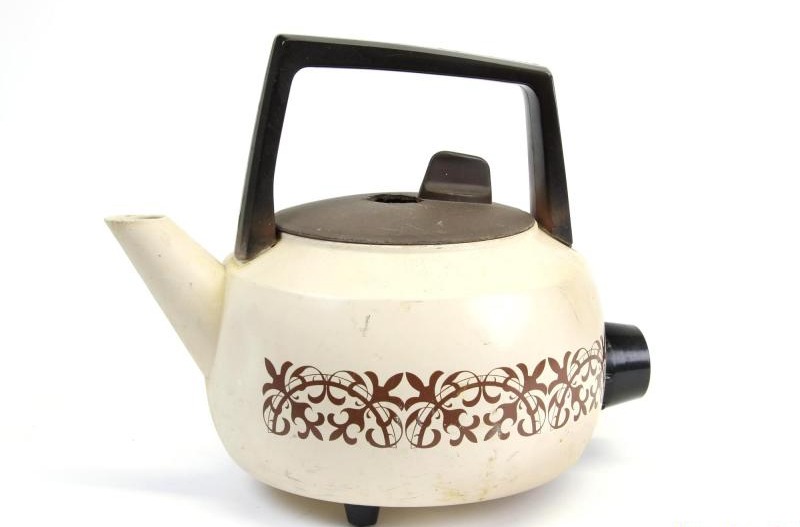 FLOWER POWERED . . .  three-pint kettle with floral design is up to 50 years old