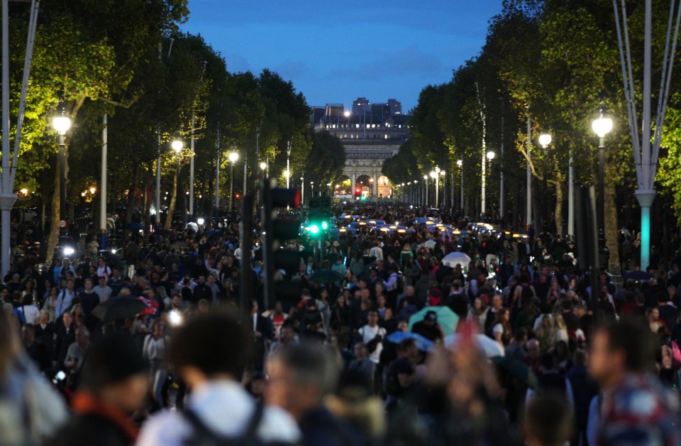 Thousands lined The Mall after dark to pay their respects