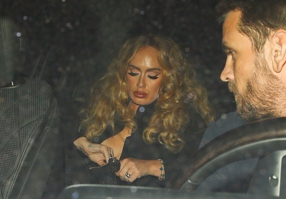 Adele wore a gold band on her wedding finger as she arrived at Beyonce’s 41st birthday party