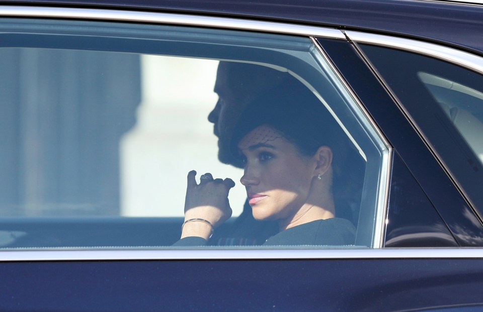 Meghan appeared emotional as she and Harry left the service