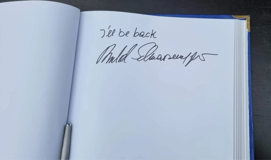 The Hollywood legend wrote 'I'll be back' in a guest book