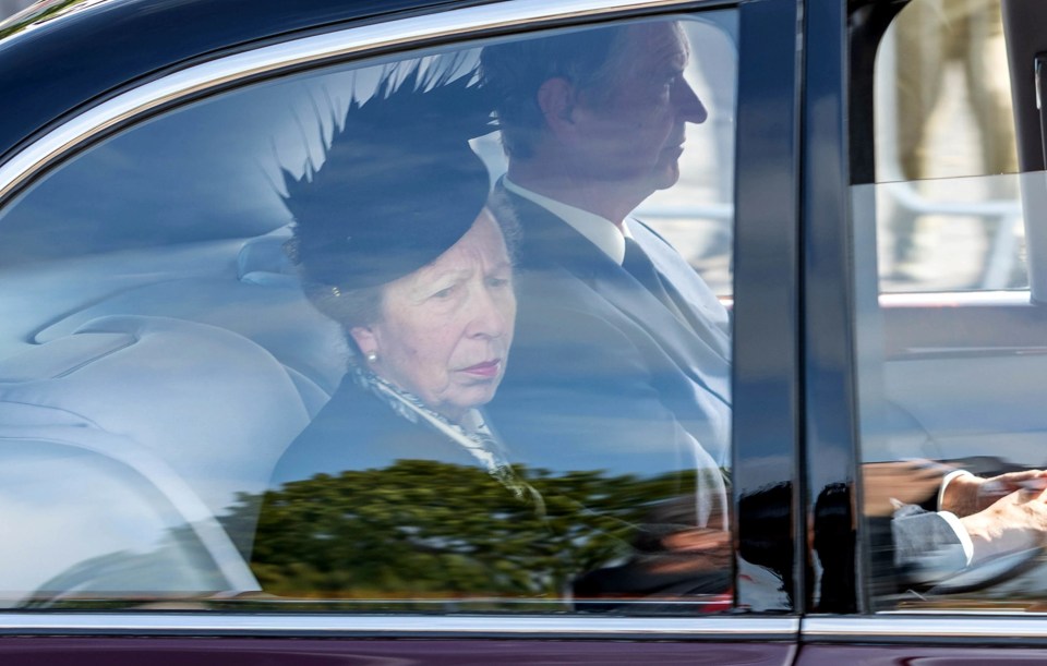 The Princess Royal appeared sorrowful as she looked on at the crowds gathered outside