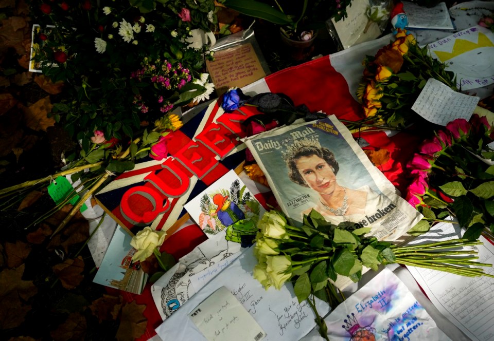 Thousands of people have left gifts and flowers outside Buckingham Palace in commemoration of The Queen’s death.