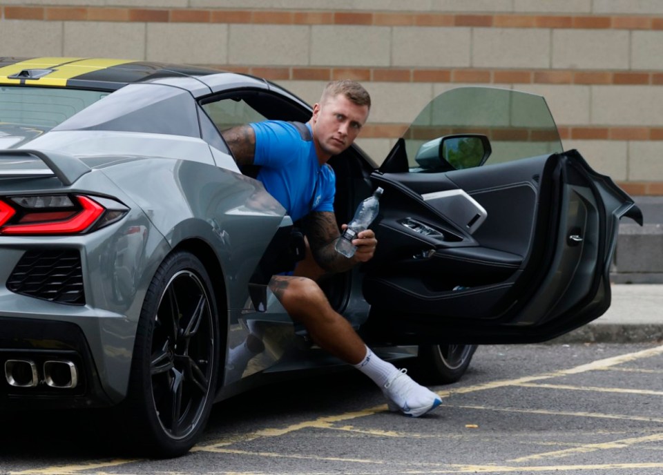 Husband Dan Osborne stepped out of his new £80k Corvette sports car for the visit