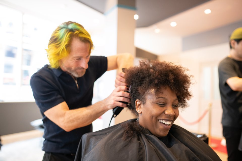 A happy customer receives a Star Trek inspired trim in Brighton