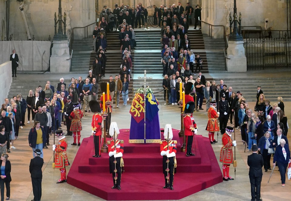 Mourners file past the Queen’s coffin at Westminster Hall, London