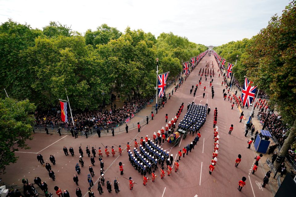 A sombre procession as Her Majesty's coffin is taken on its final journey along the Mall