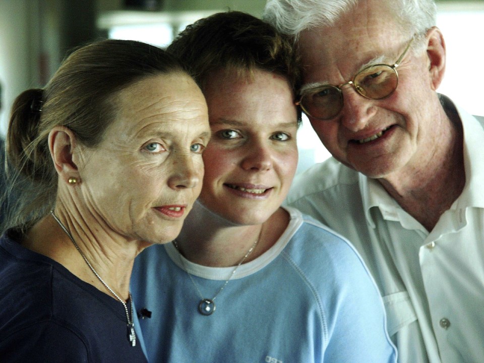 Polly with mum Rosemary and dad Peter, as they flew home from Brisbane