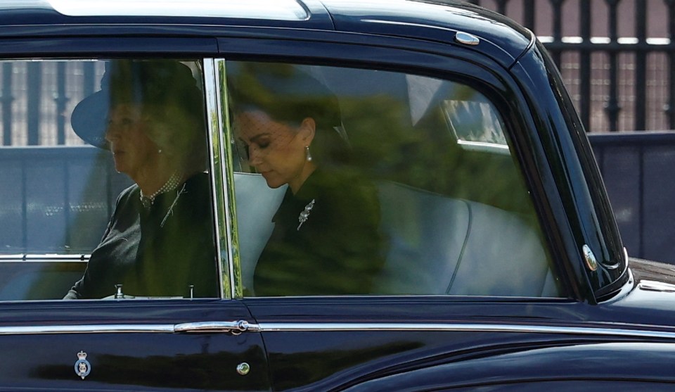 Kate was seen taking a poignant moment of reflection as she travelled behind the Queen's coffin