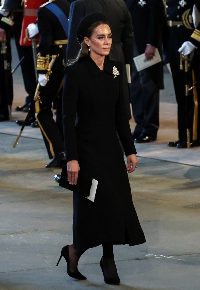 The Princess of Wales reacts as the coffin arrives at Westminster Hall