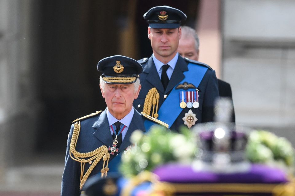 He looked sombre as he followed the coffin followed by his son