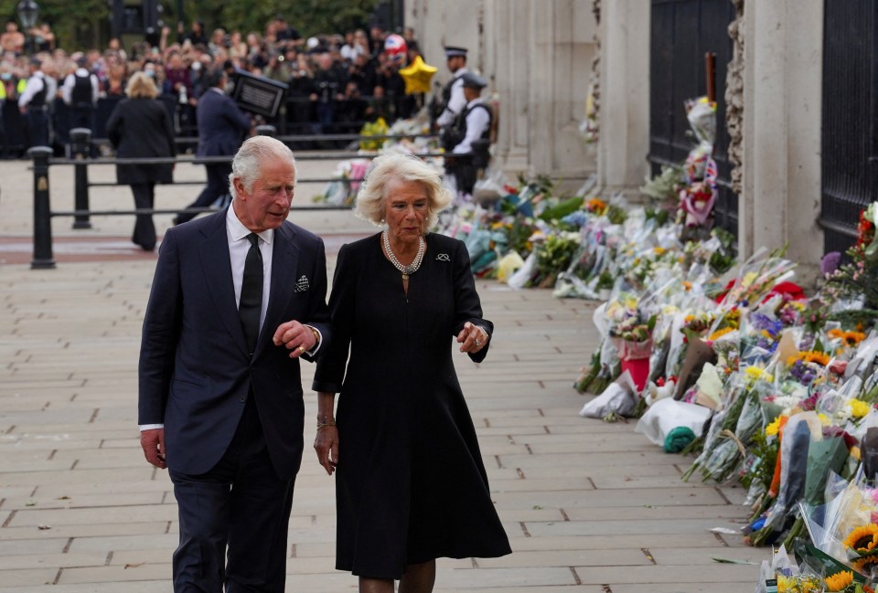 Charles and Camilla looked at tributes for the Queen yesterday