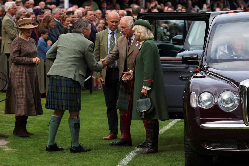 Charles and Camilla were given a warm welcome as they arrived for the Games this afternoon