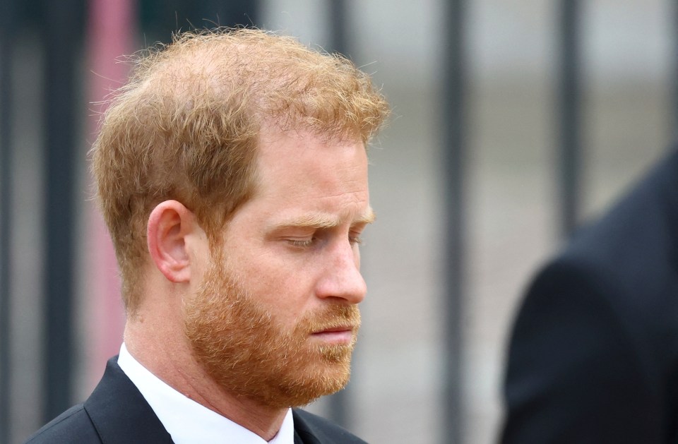 An emotional looking Prince Harry with his eyes closed as the world pays homage to his grandmother