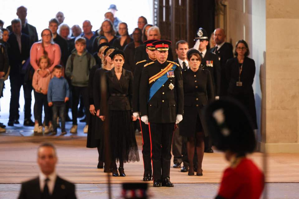 The Queen's grandchildren stood guard of her coffin last night