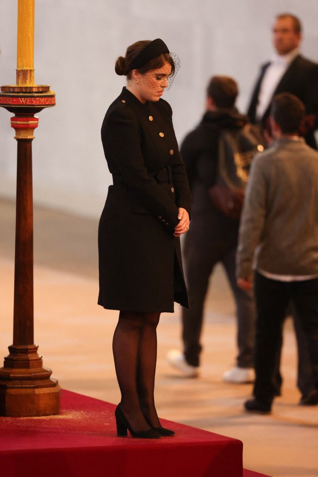 Princess Eugenie bows her head at the vigil