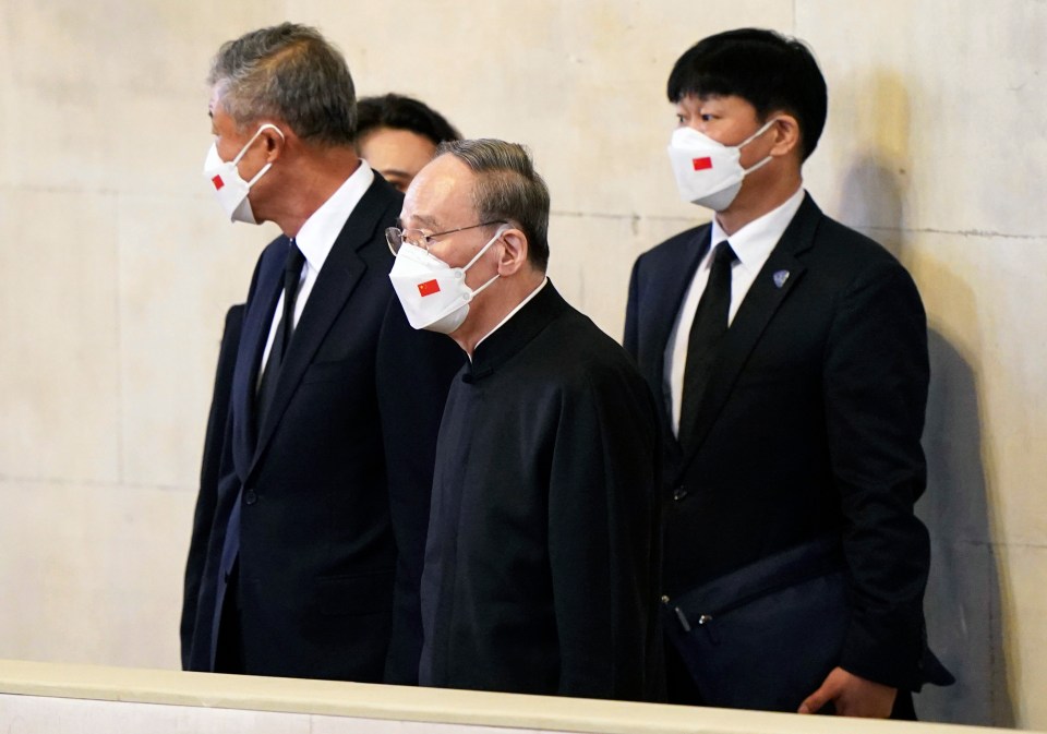 The Chinese delegation view the coffin of the Queen in Westminster Hall