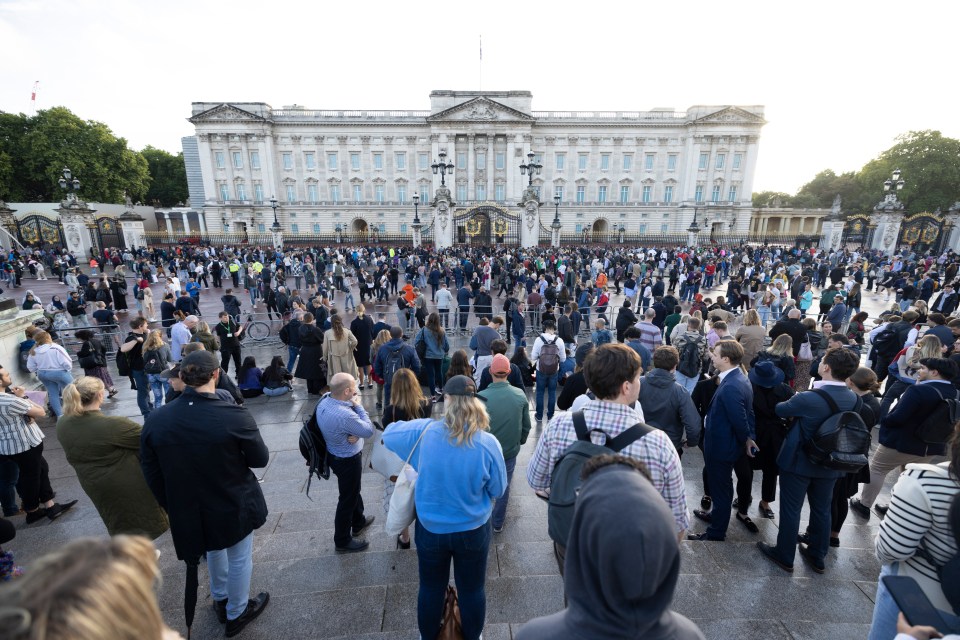 Crowds gathered outside Buckingham Palace earlier today