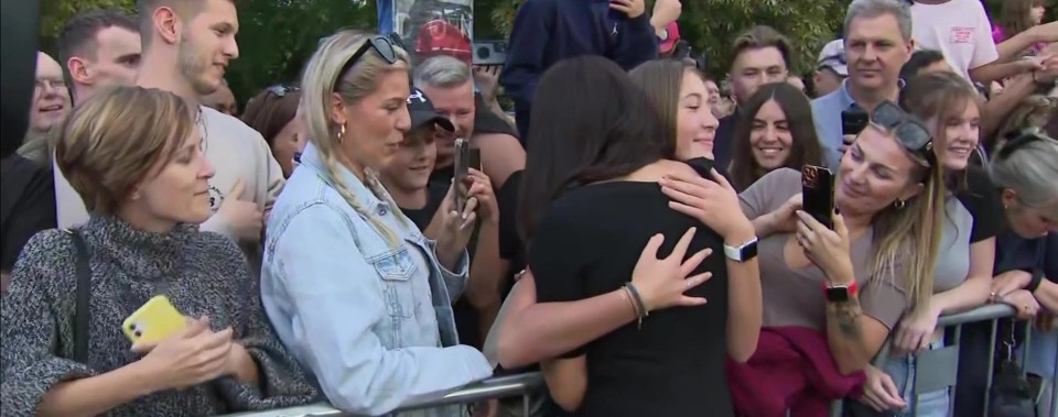 Meghan received a hug from fans