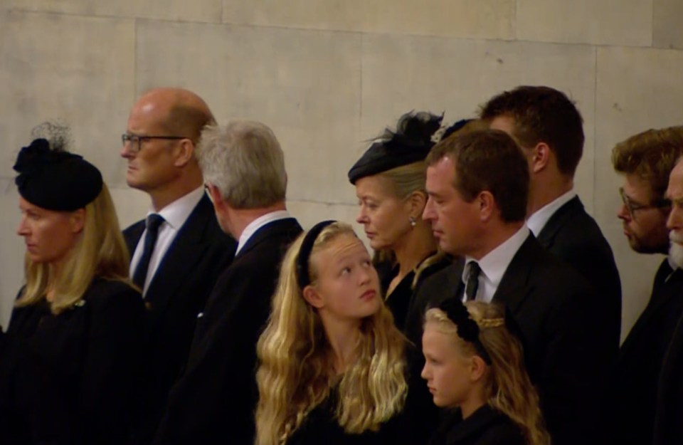 Savannah Phillips turned to look at her father Peter Phillips during Queen Elizabeth II’s vigil on Friday night