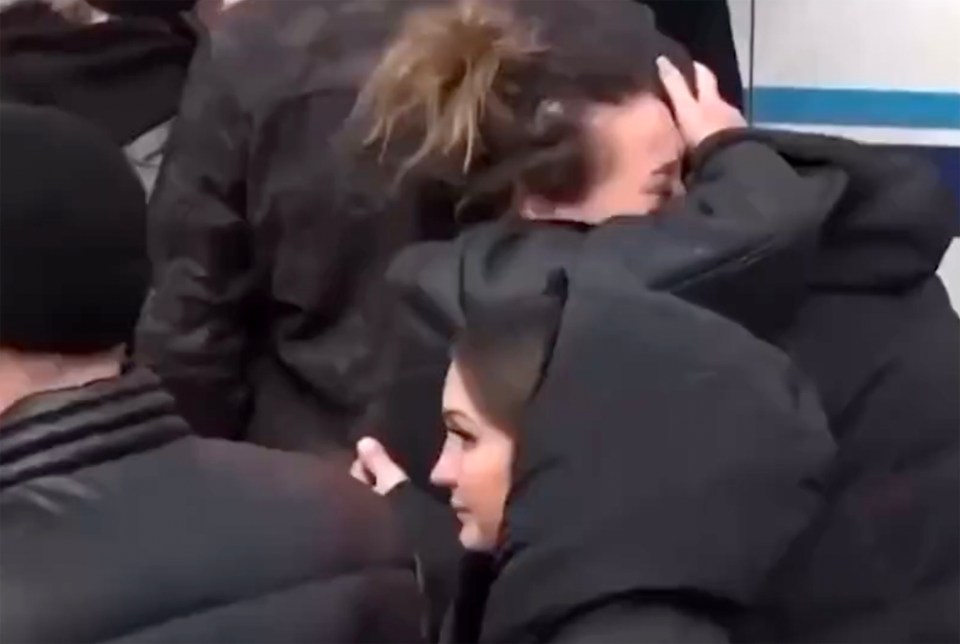 Tearful women have been filmed saying goodbye to loved ones