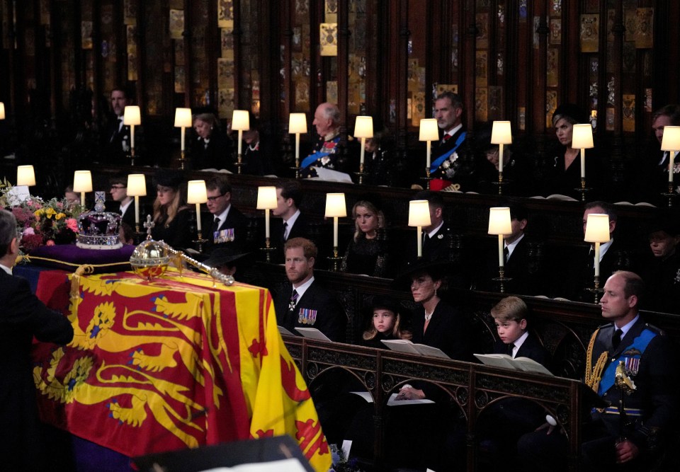 The Duke of Sussex, Princess Charlotte, the Princess of Wales, Prince George, and the Prince of Wales, watch as the Imperial State Crown and the Sovereign’s orb and sceptre are removed from the Queen’s coffin