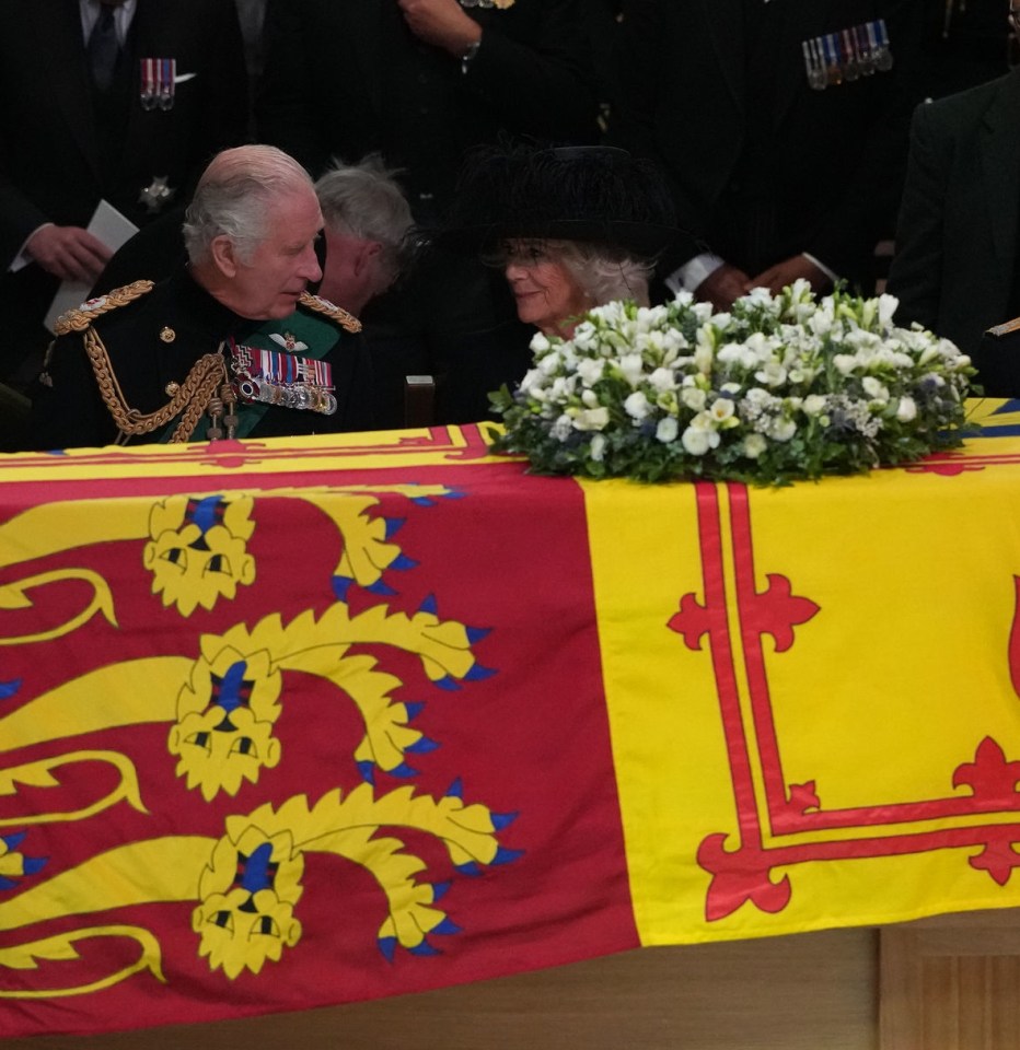 Charles and Camilla share a moment in the cathedral