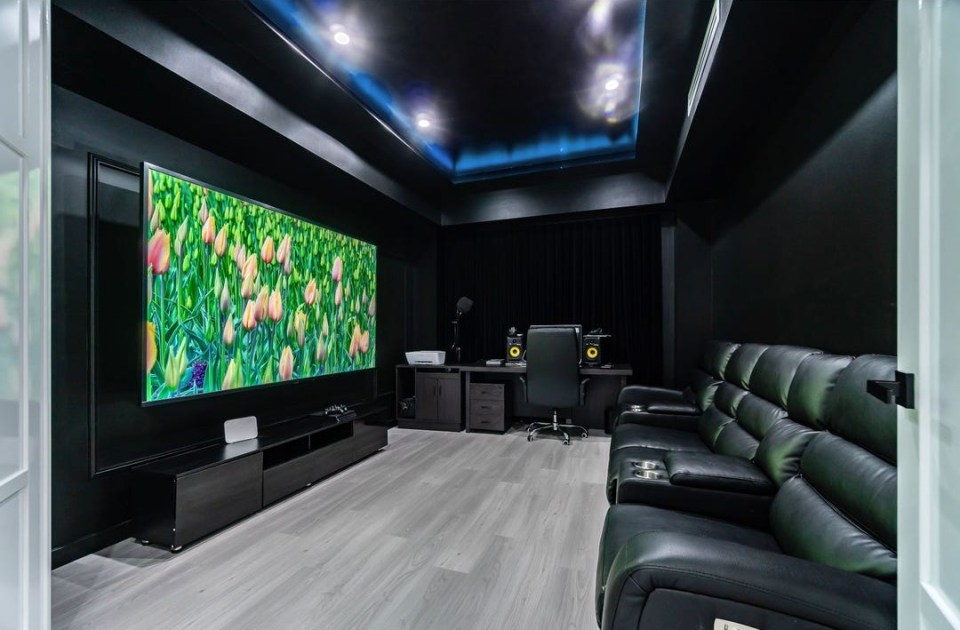 A stunning cinema room is featured inside the stunning home