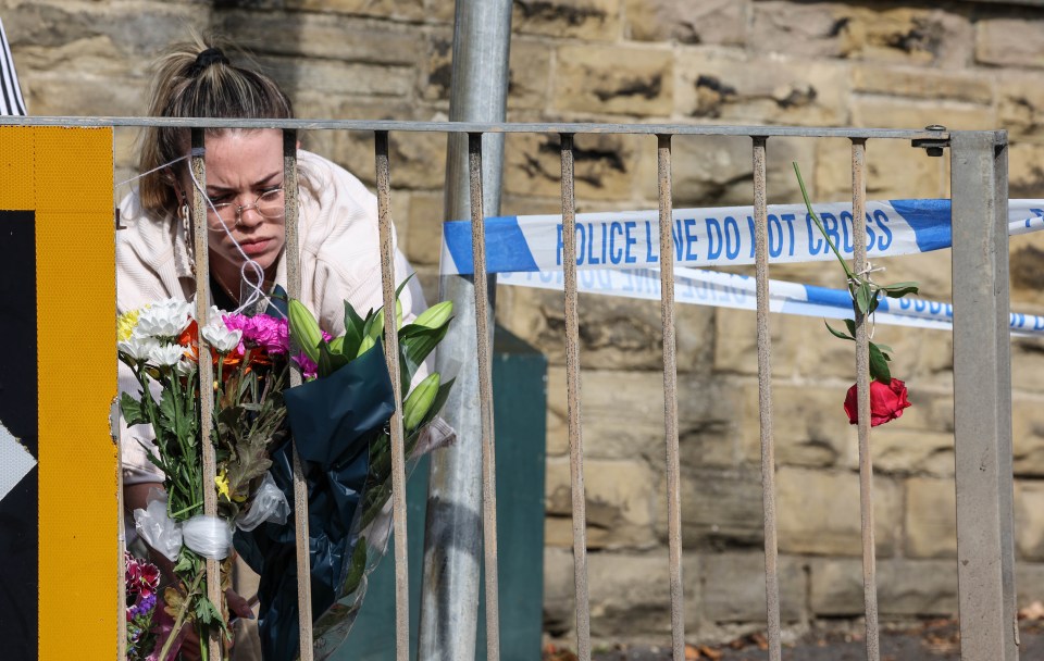 Flowers  being left near the scene in Woodhouse Hill, Huddersfield