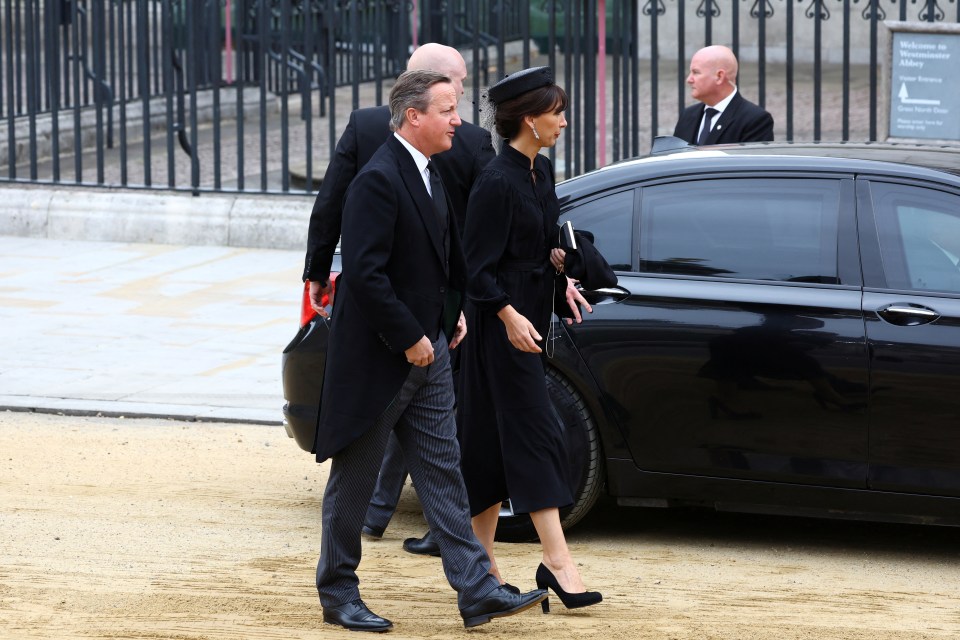 David Cameron and his wife Samantha walk outside