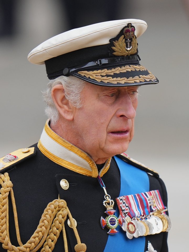 The King appeared overcome with emotion as he followed the coffin of his mother into Westminster Abbey