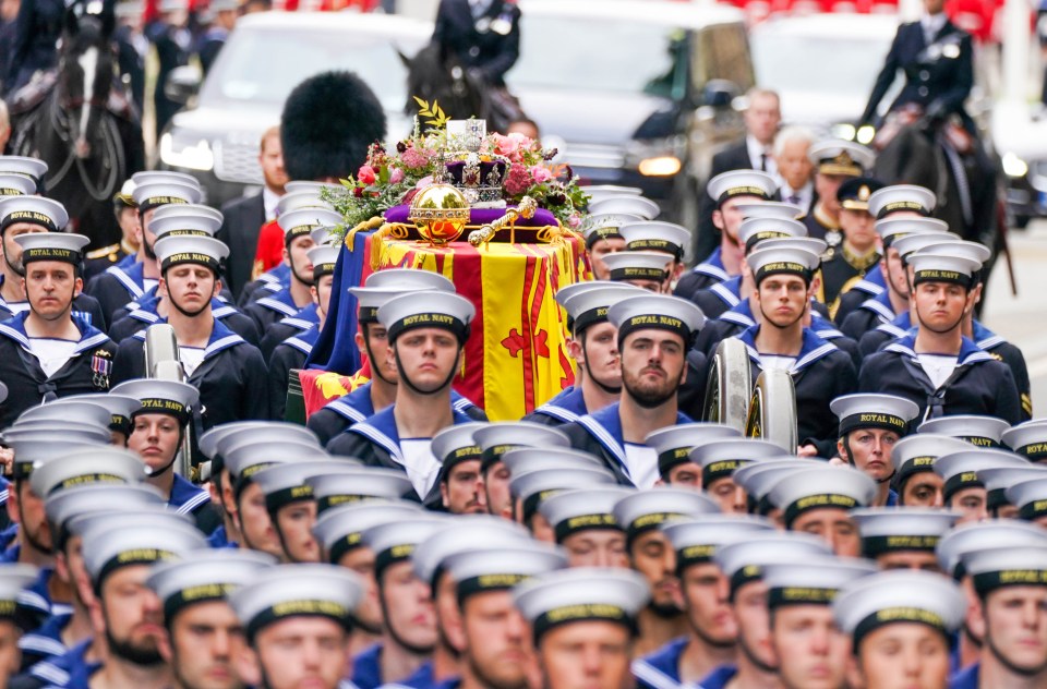 The Queen’s coffin is carried on a 123-year-old gun carriage towed by 98 Royal Navy sailors in a tradition dating back to the funeral of Queen Victoria