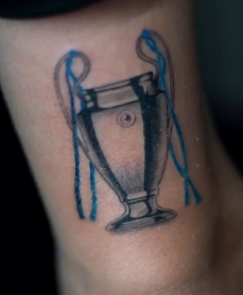 One of his tattoos is of the Champions League trophy