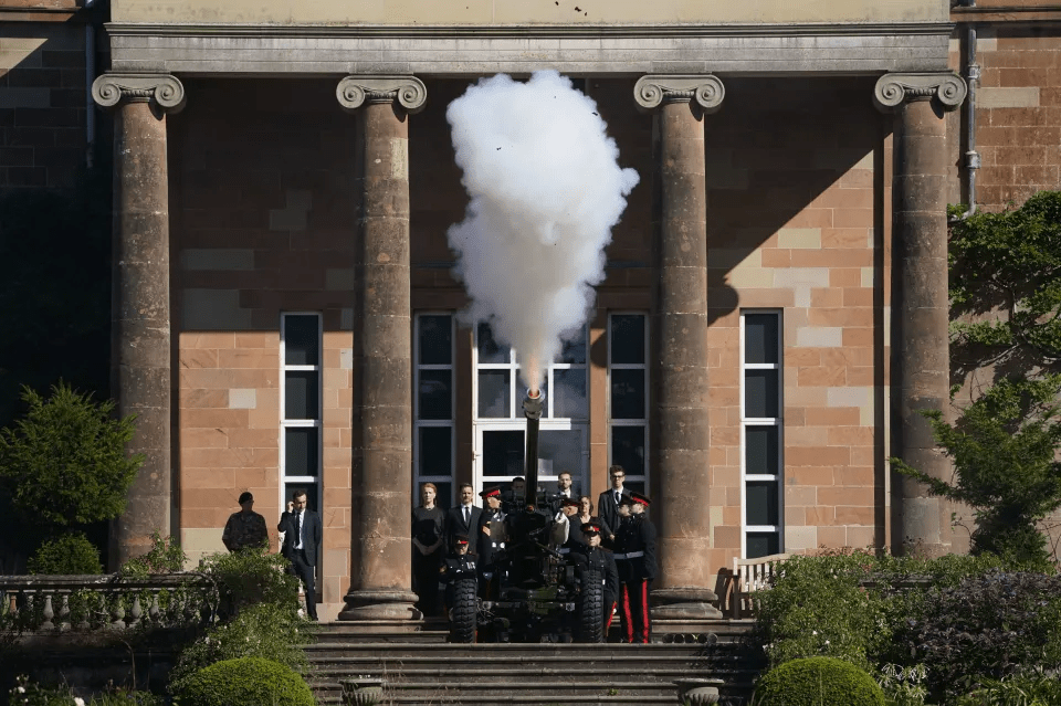 A gun salute by the 105 Regiment Royal Artillery at Hillsborough Castle, Belfast, today