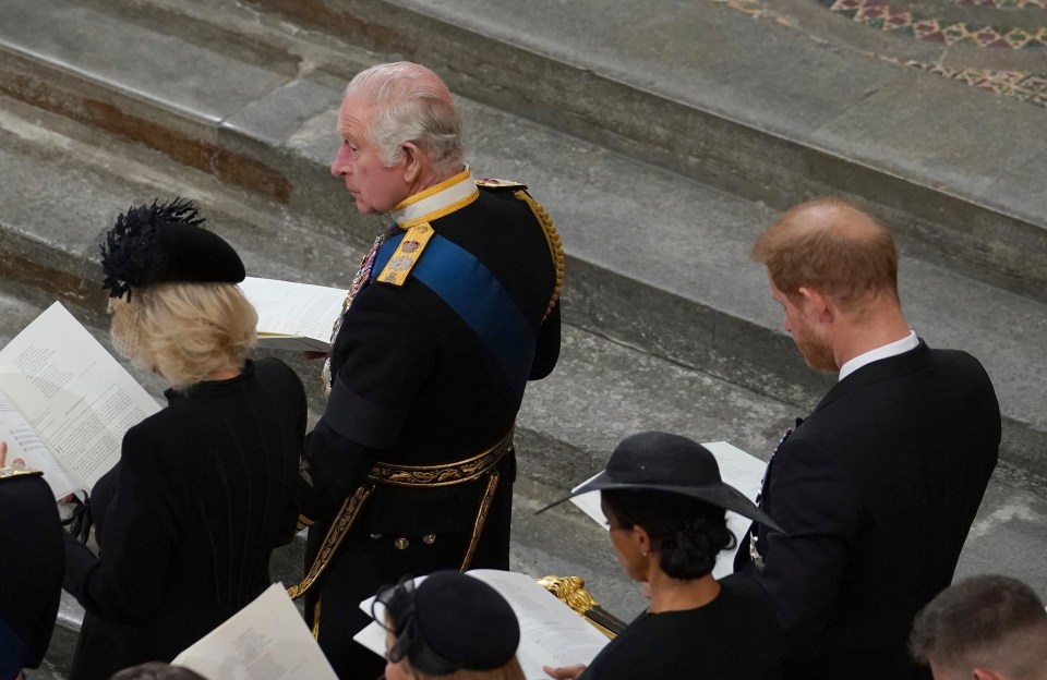 Meghan Markle and Prince Harry sat behind King Charles and Camilla, the Queen Consort