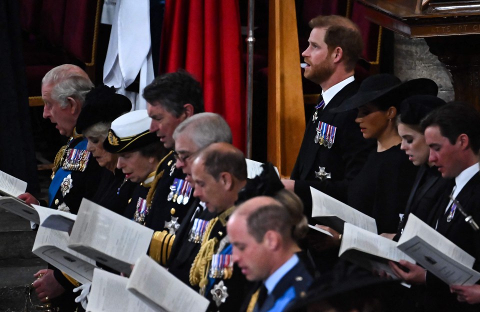 Prince Harry looks upwards as the congregation sing a hymn at The Queen’s State Funeral in Westminster Abbey