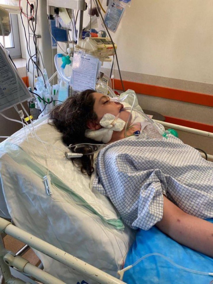 Mahsa pictured lying in a hospital bed