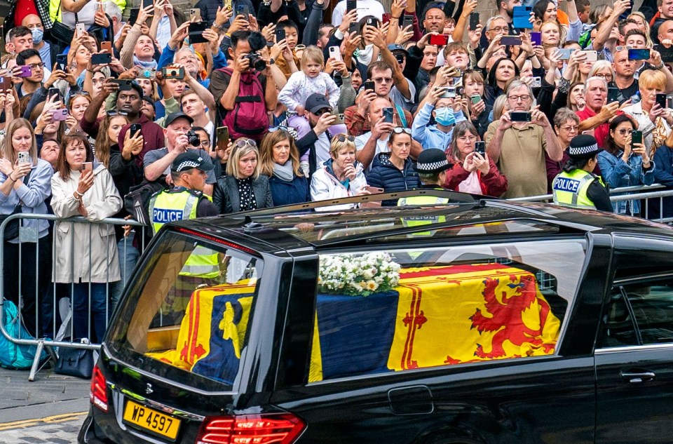 Thousands had waited hours to see the procession