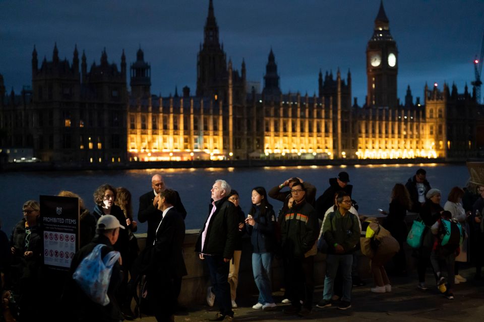 Members of the public queue through the night to see Her Majesty lying in state