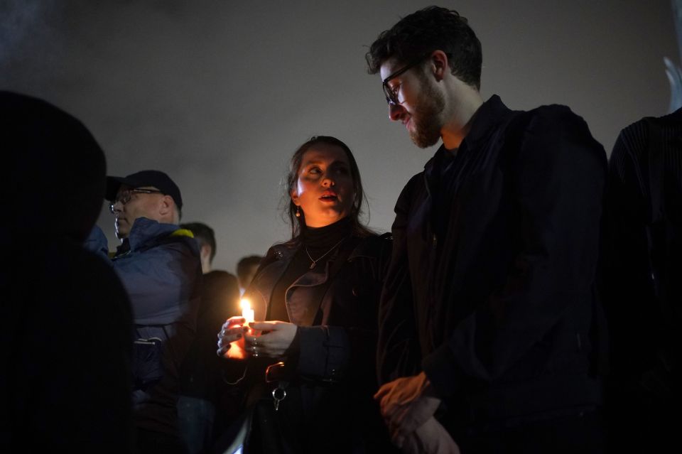 Mourners held candles outside Buckingham Palace