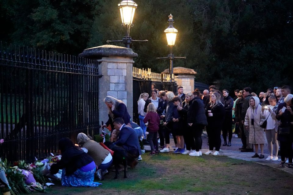 Mourners continued to lay flowers at Windsor Castle after dark