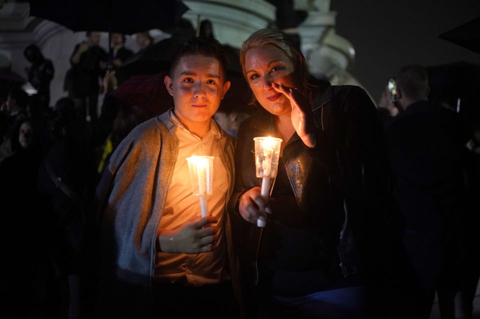 Mourners who stayed late into the night lit candles in honour of the Queen