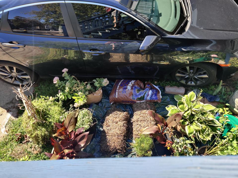 A man has been left fuming after his neighbour parked over his garden because she was "too lazy" to clear her driveway by bringing her rubbish bins in